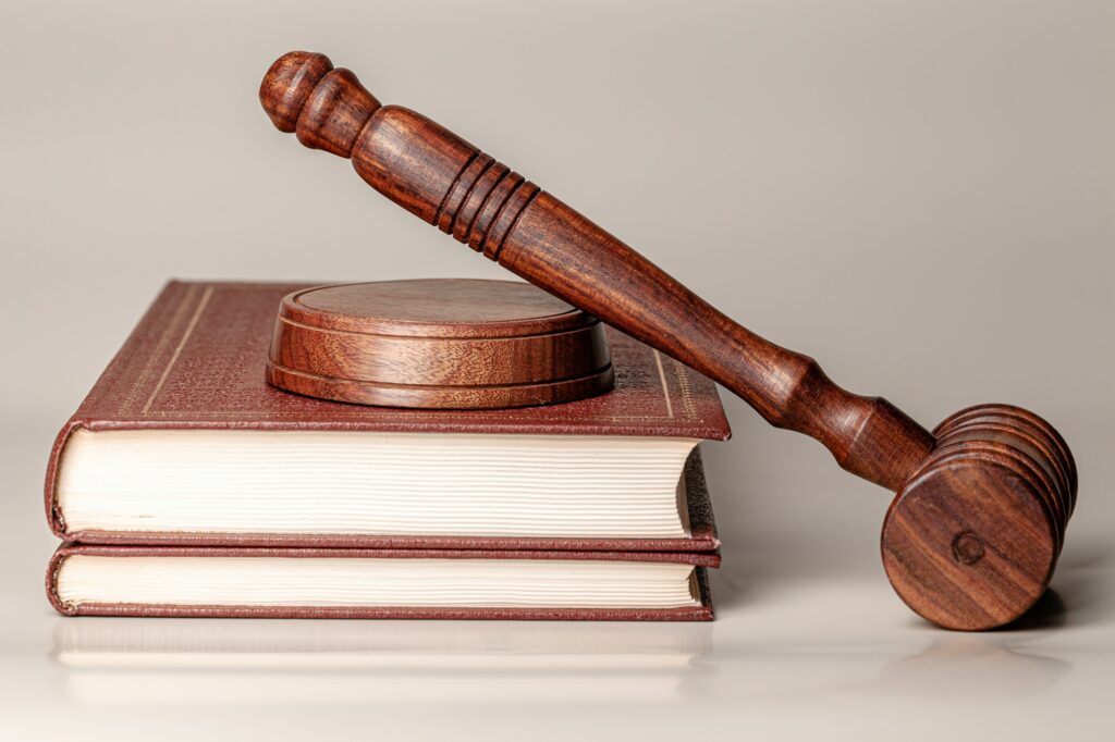 Judge gavel and legal book close up on table